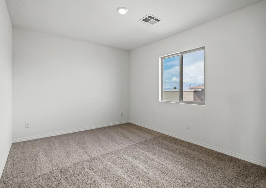 Secondary bedroom with carpet