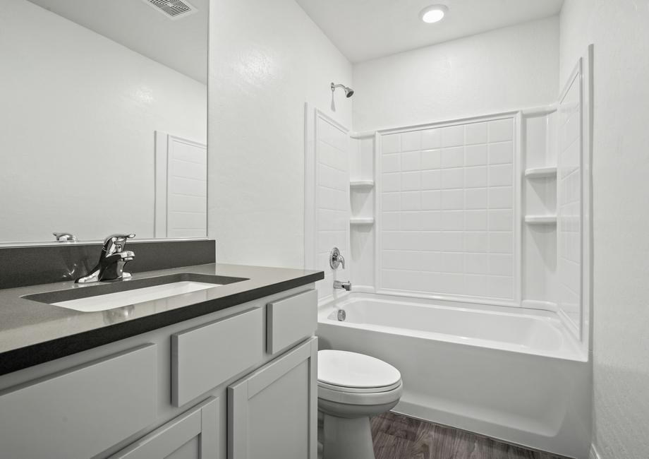 Secondary bathroom with a tub/shower combo