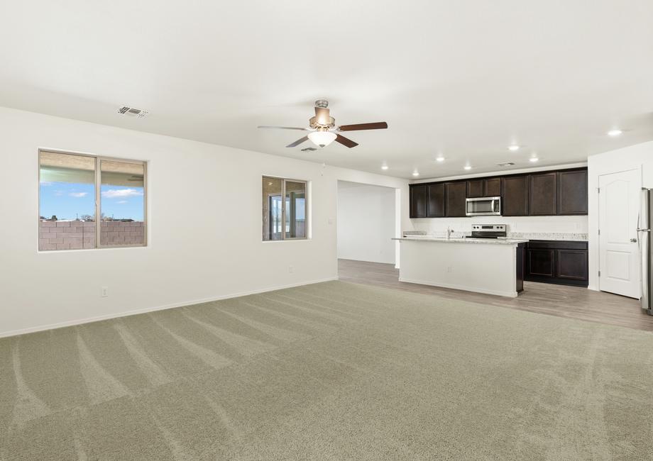 Open layout with a spacious family room and upgraded kitchen.